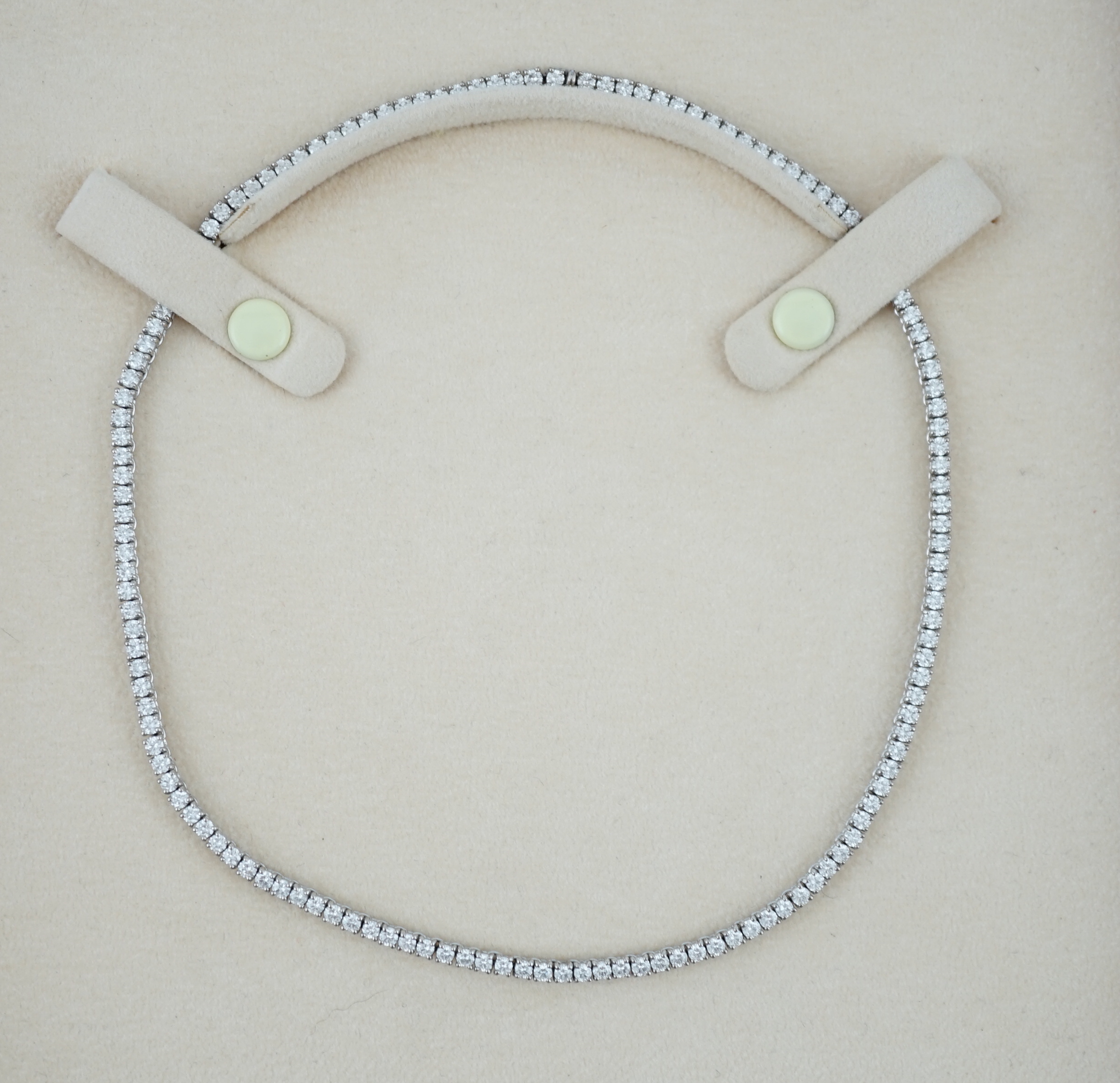 A modern Cartier 18ct white gold and diamond line choker necklace, with Cartier box and certificate dated 14/3/03